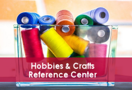 colorful spools of thread in container